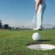 Golfer Putting on Green